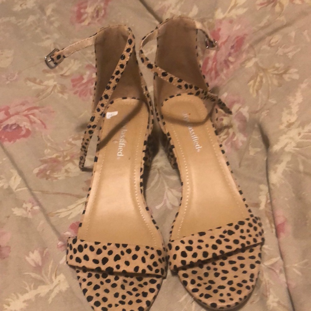 Cheetah heels gently used .